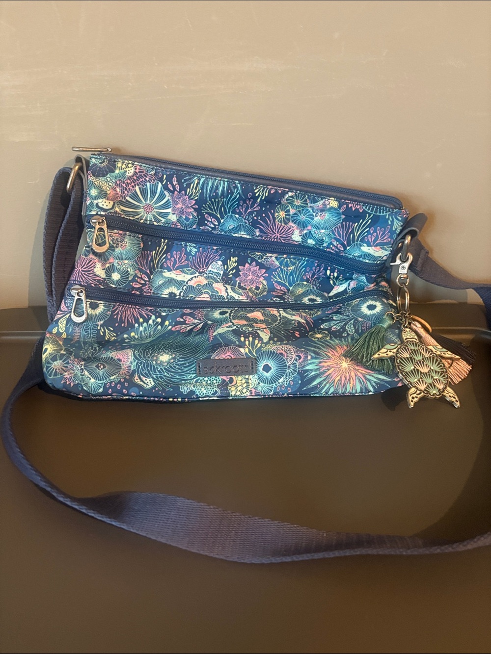 Sakroots Navy Teal Floral Crossbody Bag with Multicolor Accents